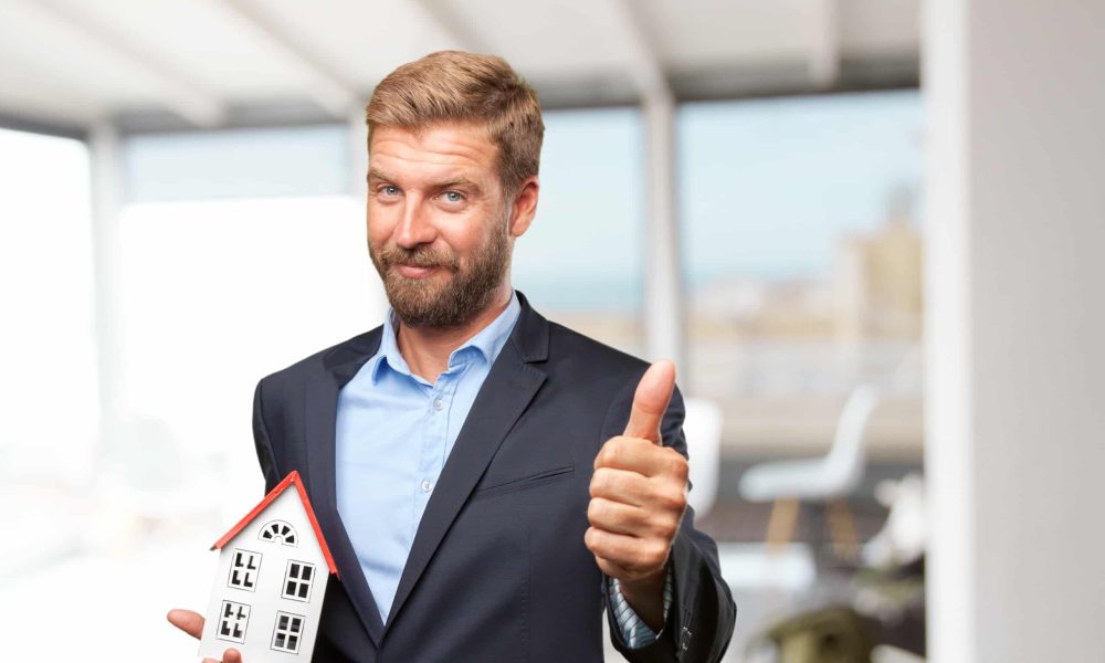 blond businessman happy expression